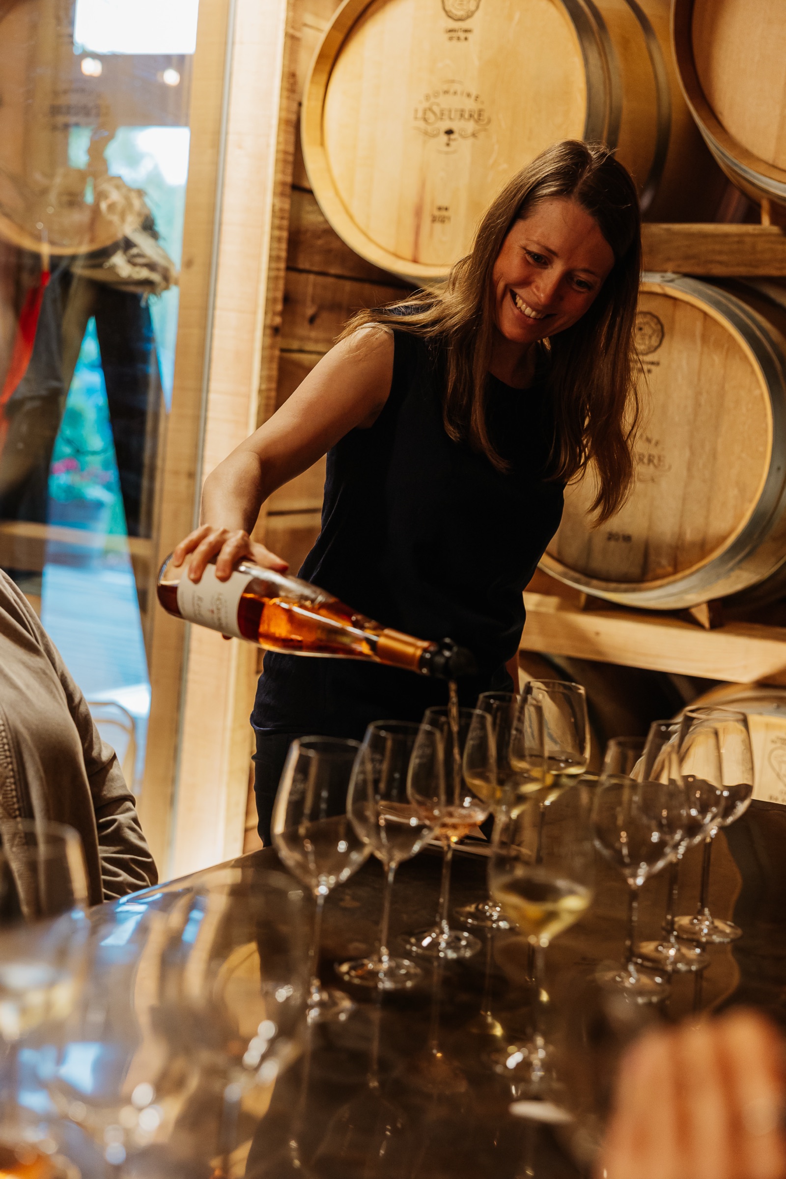 A glass being poured at a tasting.